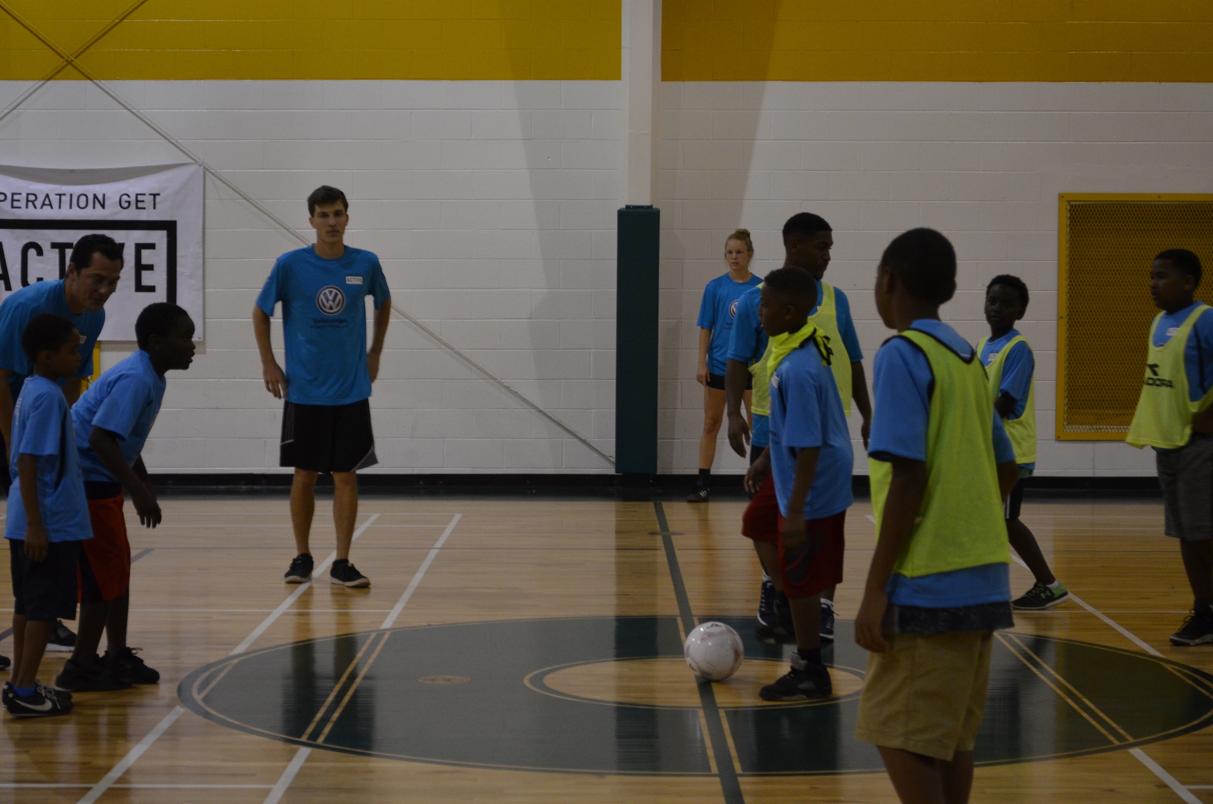 German soccer star and current Tampa Bay Rowdies player Marcel Schafer, far left, prepares the boys at the Shepherd Youth and Family Development Center to play a quick scrimmage game. Schafer, who won the German Cup and Super Cup in 2015, visited the center as part of CFC's Operation Get Active, which is sponsored by Volkswagen.
