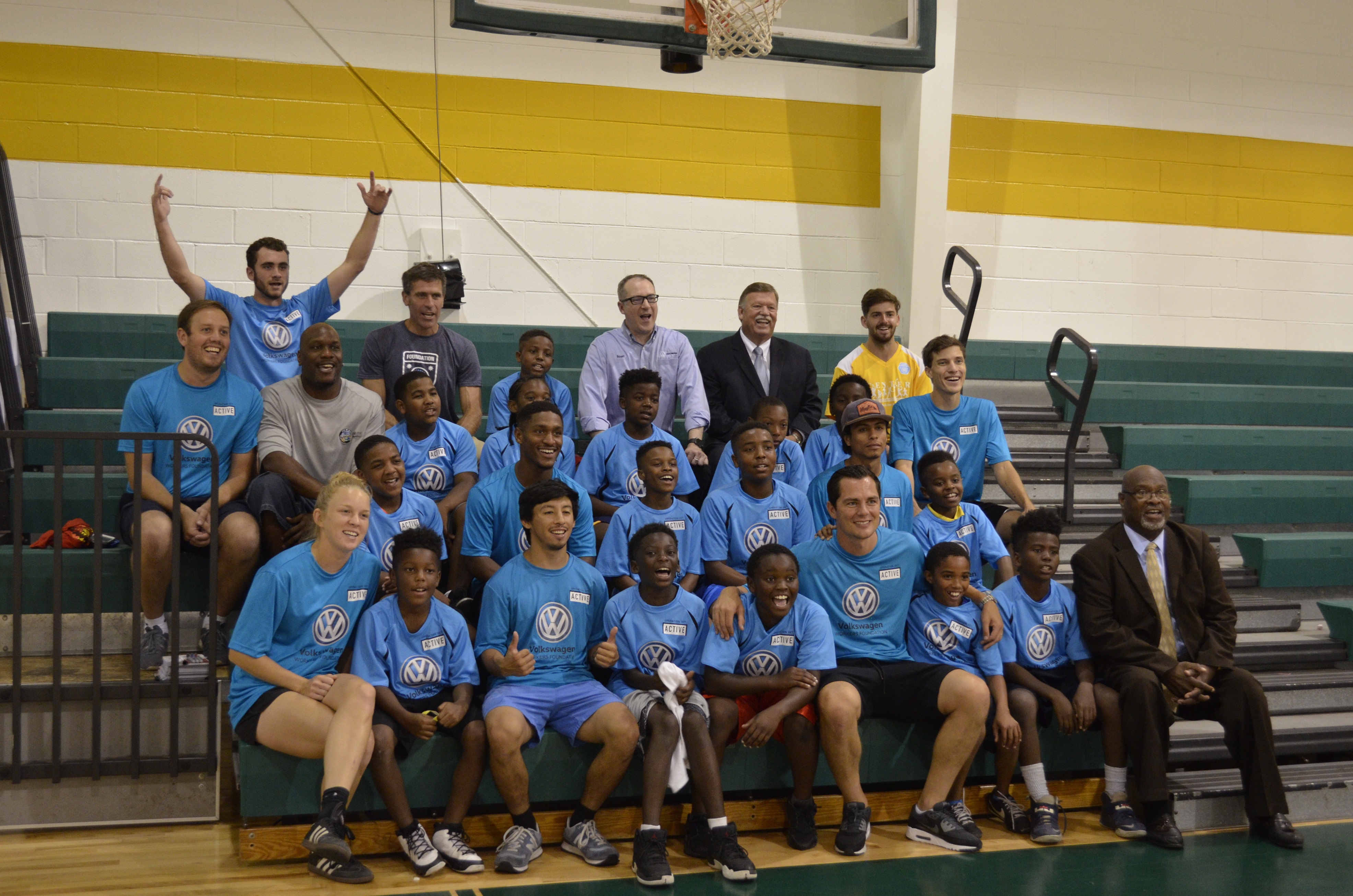 Operation Get Active leaders and the boys who participate in the program at the Shepherd YFD Center pose for a photo with German soccer star and current Tampa Bay Rowdies player Marcel Schafer, fourth from the right on the front row.
