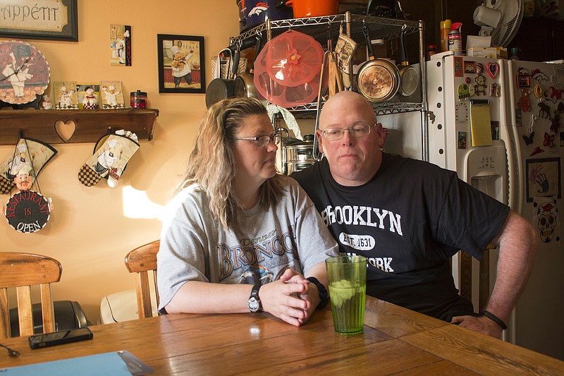 
              In this Friday, July 7, 2017, photo, Tammie Jackson, and her husband, Travis Jackson of Butte, Mont., discuss their Medicaid program benefits at their home in Helena, Mont. Tammie, who was uninsured until she enrolled in Montana's expanded Medicaid program, receives medical care for a host of health issues, including a back injury that has kept from returning to her job cleaning hotel rooms. Montana officials who tout the dramatic drop in the state's medically uninsured due to expanded Medicaid, are now under pressure to reduce the number of new Medicaid enrollees. (AP Photo/Bobby Caina Calvan)
            