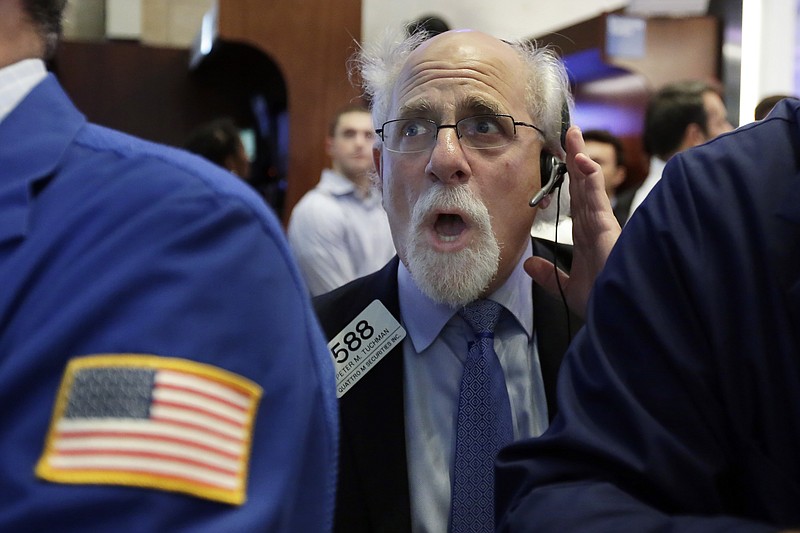 
              Trader Peter Tuchman works on the floor of the New York Stock Exchange, Monday, July 17, 2017. Stocks are starting the week mostly lower, having closed at all-time highs the week before. (AP Photo/Richard Drew)
            