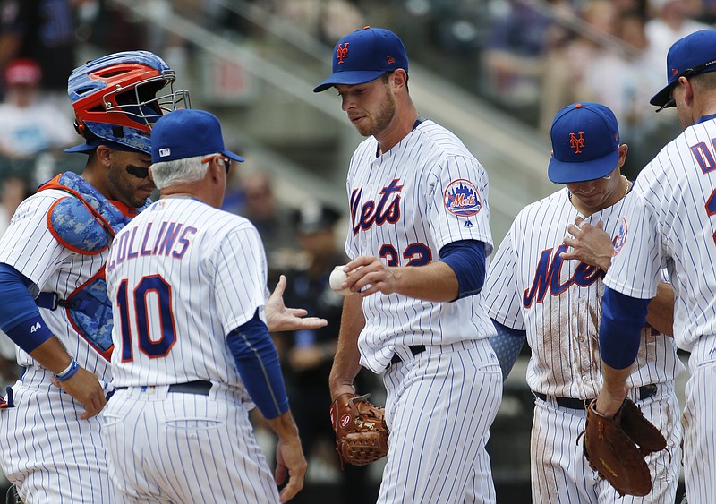 
              New York Mets starting pitcher Steven Matz (32) hands the ball to New York Mets manager Terry Collins (10) during the second inning of a a baseball game, Sunday, July 16, 2017, in New York. (AP Photo/Kathy Willens)
            