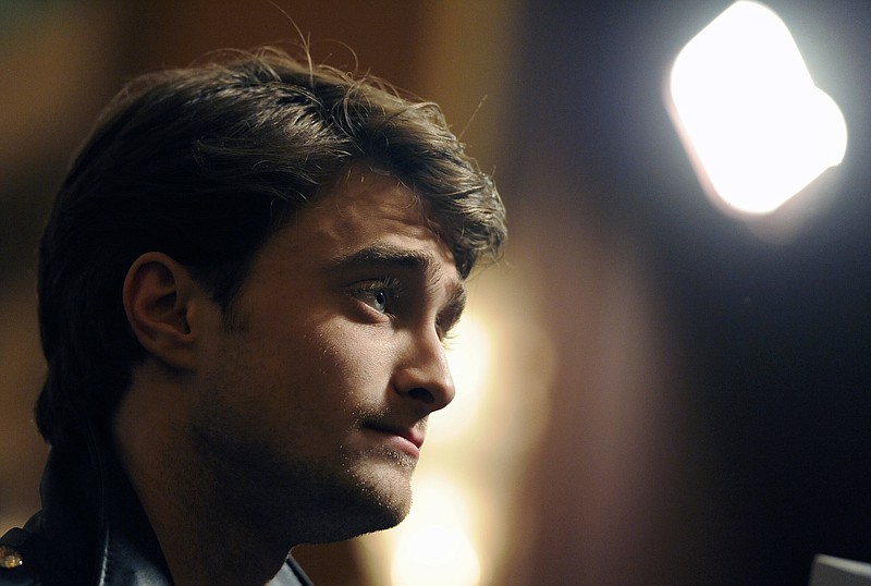 
              FILE - In this Thursday, Feb. 2, 2012 file photo, Daniel Radcliffe, a cast member in "The Woman in Black," looks on during an interview at the premiere of the film in Los Angeles.  Radcliffe has come to the aid of a man who was mugged by moped-riding attackers in London. Former police officer David Videcette told the Evening Standard newspaper that two moped riders attacked a man just off the upmarket King's Road in west London, slashing him across the face and making off with a Louis Vuitton bag.  (AP Photo/Chris Pizzello, File)
            