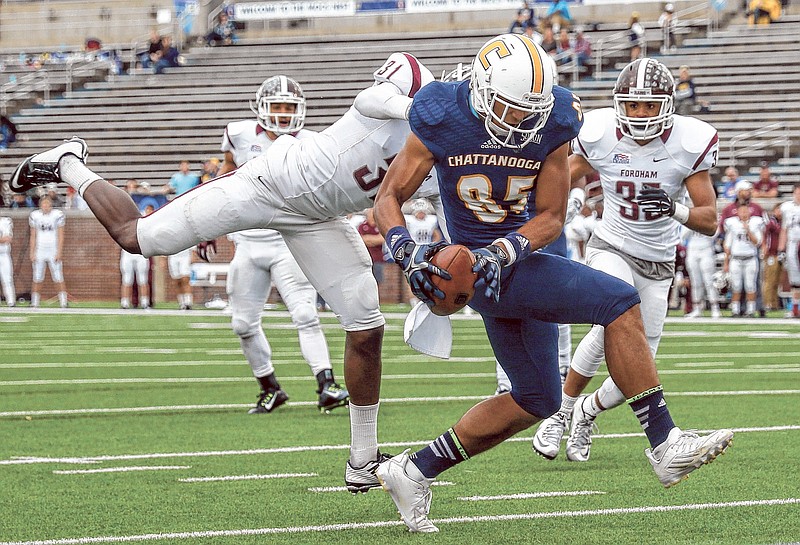 UTC wide receiver James Stovall (85) steps into the end zone as he catches a pass against Fordham defensive back Caleb Ham on Nov. 28 at Finley Stadium. Stovall was a second-team All-Southern Conference selection in 2016 and a preseason second-teamer Tuesday at media day.