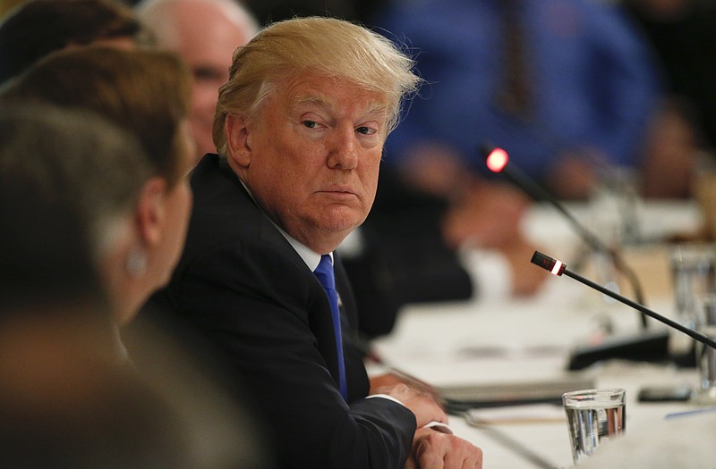 
              President Donald Trump listens during a "Made in America," roundtable event in the East Room of the White House, Wednesday, July 19, 2017, in Washington. (AP Photo/Alex Brandon)
            