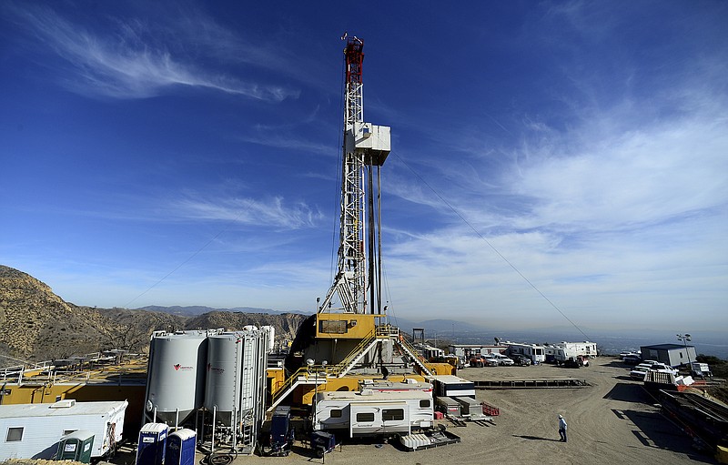 
              FILE - In this Dec. 9, 2015, file pool photo, crews work on a relief well at the Aliso Canyon facility above the Porter Ranch area of Los Angeles. Two state agencies said Wednesday, July 19, 2017, that the Southern California Gas Co., can resume storing natural gas at the Aliso Canyon facility, which stopped operations in the wake of an October 2015 blowout. However, storage will be restricted to about 28 percent of the field's capacity. (Dean Musgrove /Los Angeles Daily News via AP, Pool)
            