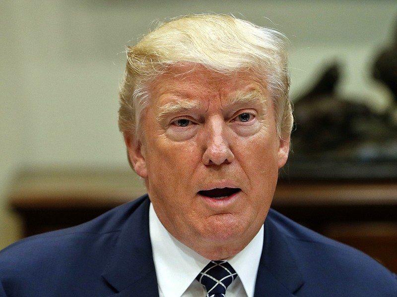 
              President Donald Trump speaks while having lunch with services members in the Roosevelt Room of the White House in Washington, Tuesday, July 18, 2017. Trump had a second, previously undisclosed conversation with Russian President Vladimir Putin at a summit it Germany. White House spokesman Sean Spicer says that Trump and Putin spoke during a world leaders’ dinner at the Group of 20 summit in Hamburg earlier this month.(AP Photo/Pablo Martinez Monsivais)
            