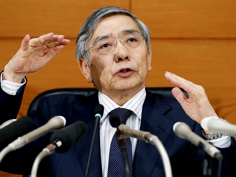 
              In this Wednesday, Sept. 21, 2016 photo, Bank of Japan Gov. Haruhiko Kuroda speaks during a news conference at the central bank headquarters in Tokyo. Japan's central bank has opted to keep its lavish monetary stimulus intact while downgrading its outlook for inflation.  The Bank of Japan's policy meeting ended Thursday, July 20 2017,  with no change to its injections of trillions of yen (hundreds of billions of dollars) into the economy each year through government bond purchases.(Kazushige Fujikake/Kyodo News via AP)
            