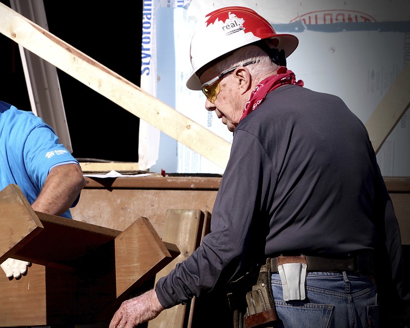 Some pundits are saying President Donald Trump could suffer the same result as former President Jimmy Carter, shown recently building a home for Habitat for Humanity in Winnipeg, Manitoba, if he doesn't right his administration.