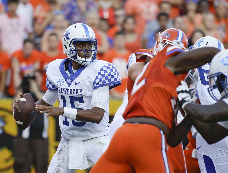 Kentucky quarterback Stephen Johnson, left, was the backup to Drew Barker early last season, including during this 45-7 loss at Florida. But the Grambling transfer took over the starting role and guided the Wildcats to the TaxSlayer Bowl.