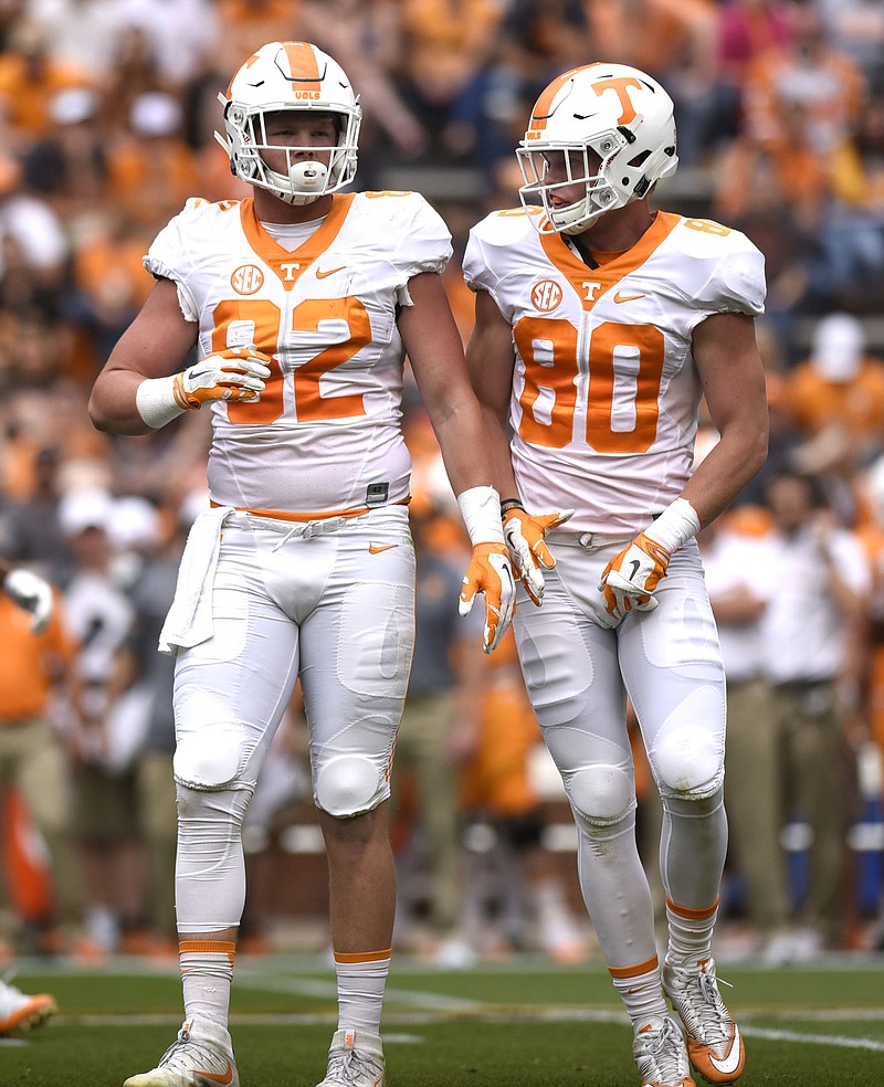 Tennessee teammates and brothers Ethan Wolf, left, and Eli Wolf prepare for the next play during the Orange and White spring game in April at Neyland Stadium. Ethan is part of a senior class that will start the season having won three straight bowl games.