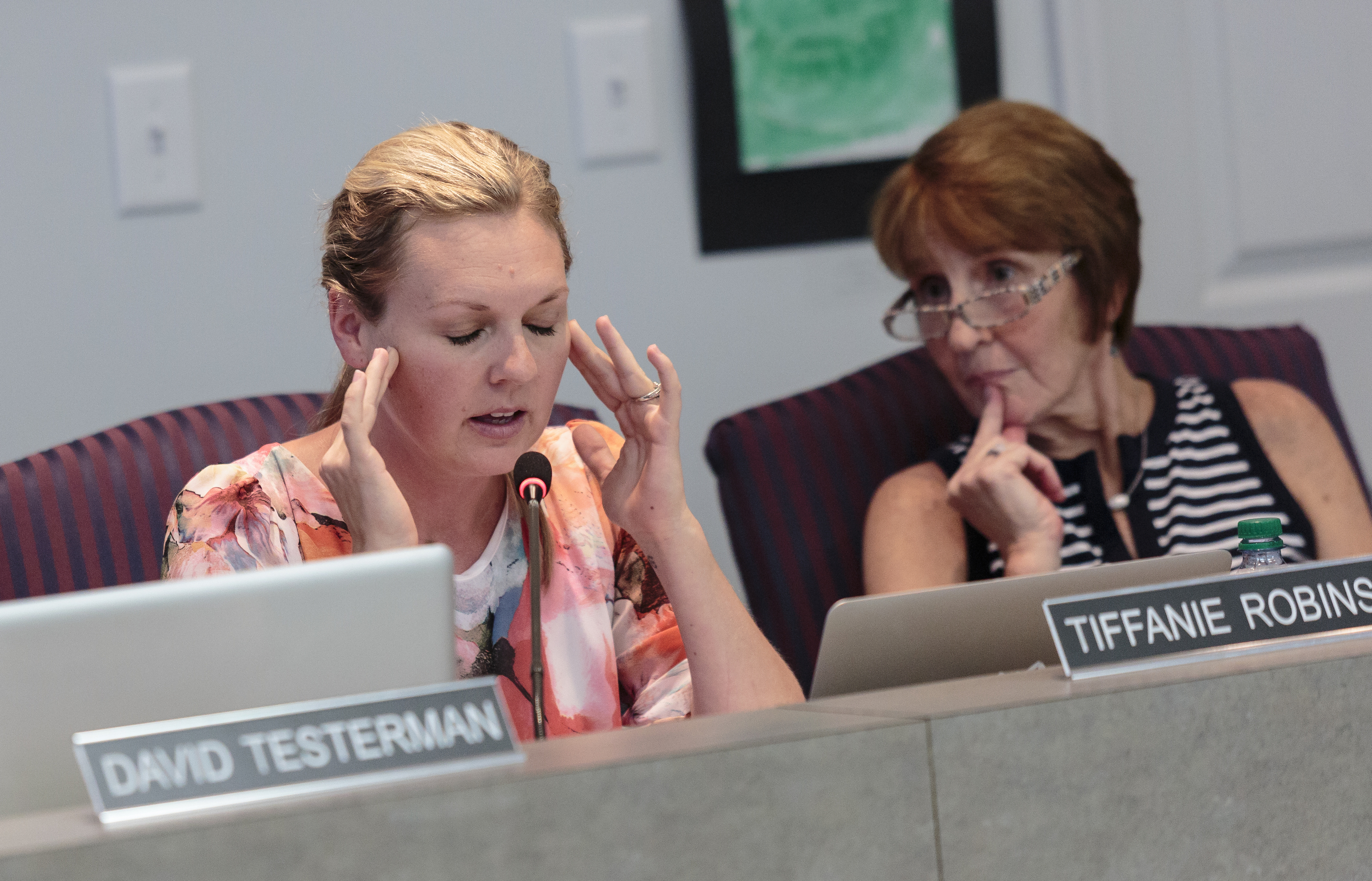 Hamilton County School Board members Tiffanie Robinson, left, and Kathy Lennon discuss a school Partnership Zone proposal during a Hamilton County Board of Education meeting on Thursday, July 20, 2017, in Chattanooga, Tenn. The school Partnership Zone would create an independent mini-district within Hamilton County as an alternative to complete state takeover of five low-performing schools.