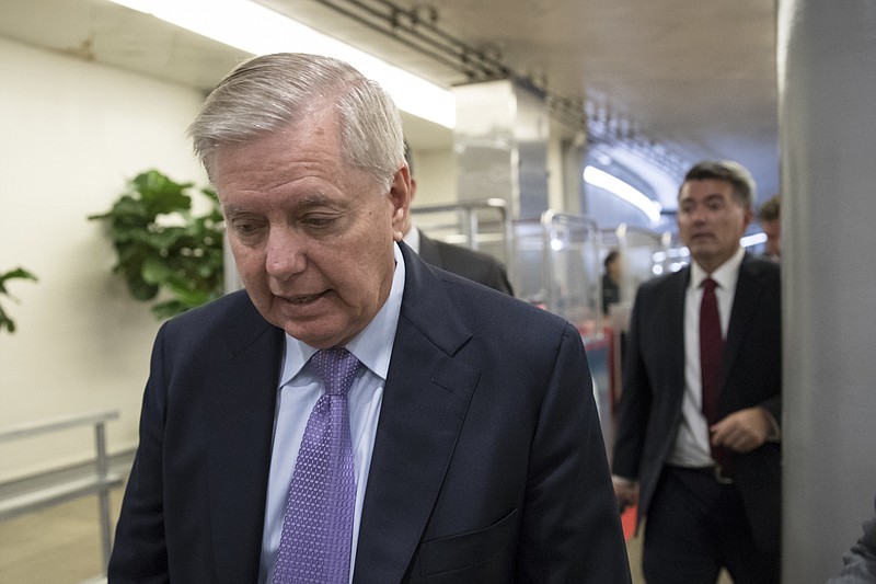 
              Sen. Lindsey Graham, R-S.C., arrives at the Senate for final votes of the week on the day after Sen. John McCain, R-Ariz., was diagnosed with an aggressive type of brain cancer, on Capitol Hill in Washington, Thursday, July 20, 2017. Sen. Graham, McCain's closest friend in the Senate, said that they had spoken by telephone Wednesday night and that the diagnosis had been a shock to McCain. "John has never been afraid of is death," said Graham, of McCain, 80, a Vietnam veteran and former prisoner of war. (AP Photo/J. Scott Applewhite)
            