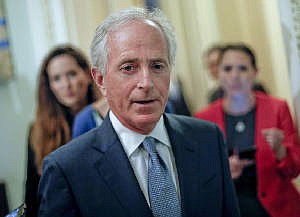 In this May 2, 2017 file photo, Sen. Bob Corker, R-Tenn., speaks to members of the media as he arrives for a policy luncheon with Vice President Mike Pence, on Capitol Hill in Washington.