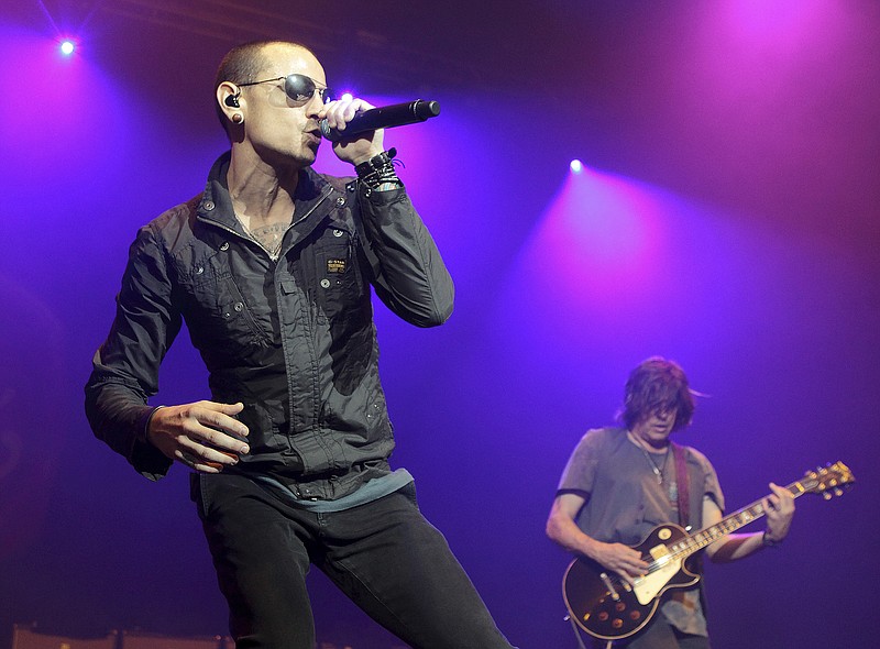In this May 16, 2015 file photo, Chester Bennington, left, performs during the MMRBQ Music Festival 2015 at the Susquehanna Bank Center in Camden, N.J. The Los Angeles County coroner says Bennington, who sold millions of albums with a unique mix of rock, hip-hop and rap, has died in his home near Los Angeles. He was 41. Coroner spokesman Brian Elias says they are investigating Bennington's death as an apparent suicide but no additional details are available. (Photo by Owen Sweeney/Invision/AP, File)