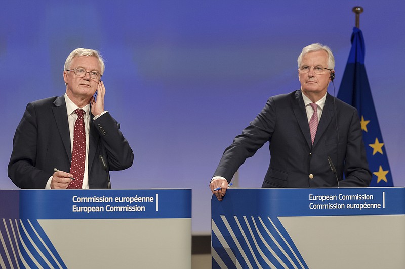 
              The EU chief Brexit negotiator Michel Barnier, right, and British Secretary of State David Davis address the media after a week of negotiations at EU headquarters in Brussels, Thursday July 20, 2017. UK's chief Brexit negotiator says week of talks with EU has given "us a lot to be positive about"(AP Photo/Geert Vanden Wijngaert)
            