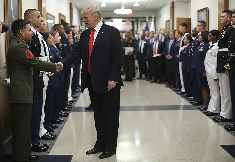 
              President Donald Trump greets military personnel during his visit to the Pentagon, Thursday, July 20, 2017. (AP Photo/Pablo Martinez Monsivais)
            