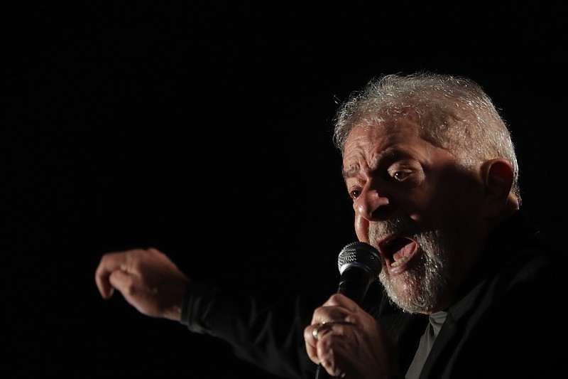 
              Brazil's former President Luiz Inacio Lula da Silva addresses supporters protesting his conviction in Sao Paulo, Brazil, Thursday, July 20, 2017, after a judge ordered the seizure of more than $2.8 million in pension funds from Silva in connection with his corruption conviction. Last week, the judge sentenced Silva to 9 1/2 years in prison in connection with a graft probe involving state-run oil giant Petrobras. (AP Photo/Andre Penner)
            