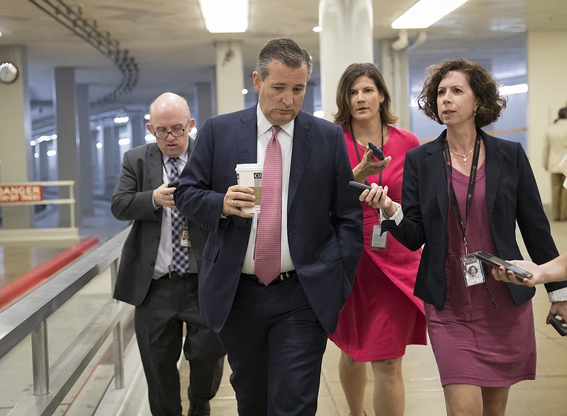 
              Sen. Ted Cruz, R-Texas, heads to the chamber for a vote, on Capitol Hill in Washington, Thursday, July 20, 2017. Majority Leader Mitch McConnell is spurring Republican senators to resolve internal disputes that have pushed their marquee health care bill to the brink of oblivion, a situation made more difficult for the GOP because of Sen. John McCain's jarring diagnosis of brain cancer. (AP Photo/J. Scott Applewhite)
            