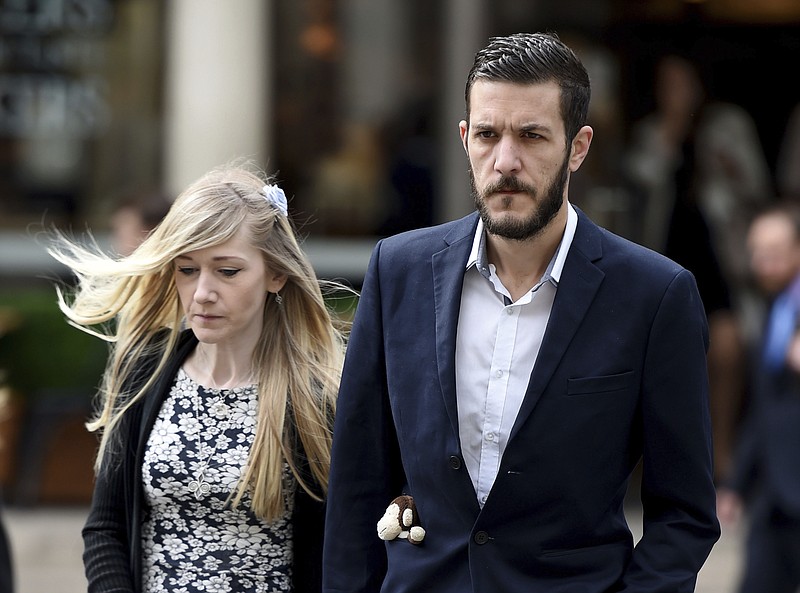 
              Charlie Gard's parents Connie Yates and Chris Gard arrive at the Royal Courts of Justice in London where the hearing will resume into the case of their terminally-ill baby, Friday July 21, 2017. A British court is giving the parents of 11-month-old Charlie Gard a chance to present fresh evidence that their terminally ill son should receive experimental treatment. (Lauren Hurley/PA via AP)
            