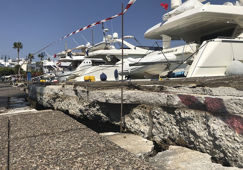
              The broken quay wall is raised by several inches in the harbor after an earthquake in Kos on the island of Kos, Greece Friday, July 21, 2017. Greek authorities said two tourists killed in the overnight quake are from Turkey and Sweden.(AP Photo/Michael Probst)
            