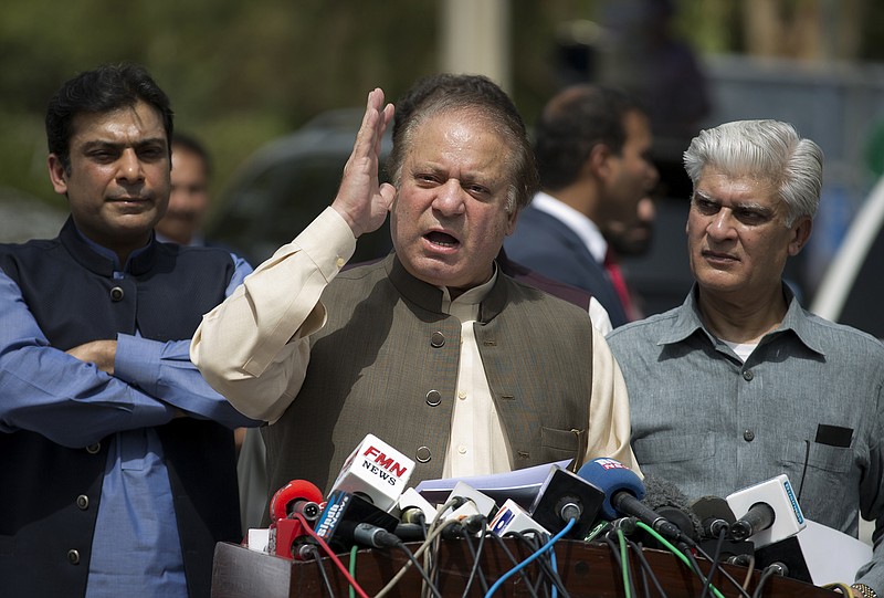 
              In this Thursday, June 15, 2017 photo, Pakistani Prime Minister Nawaz Sharif speaks to reporters outside the premises of the Joint Investigation Team, in Islamabad, Pakistan. Pakistan's supreme court on Friday, July 21, 2017, conducted its hearing into a high-profile case involving allegations of corruption against Sharif and his family but it wasn’t immediately clear when a verdict would be announced, defense lawyers and attorneys for petitioners said. (AP Photo/B.K. Bangash)
            