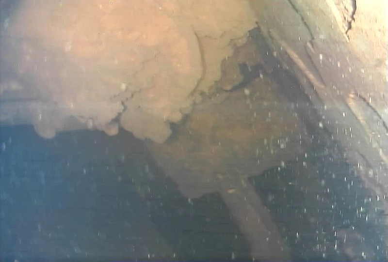 
              This image captured by an underwater robot provided by International Research Institute for Nuclear Decommissioning shows lava-like lumps believed to contain melted fuel inside the Unit 3 reactor at Fukushima Dai-ichi nuclear plant in Okuma town, northeastern Japan, Friday, July 21, 2017. Plant operator Tokyo Electric Power Co. said the robot found the objects Friday on its second mission inside the primary containment vessel of the Unit 3 reactor at Fukushima, which was destroyed by a massive earthquake and tsunami. Experts believe the fuel melted and much of it fell to the chamber's bottom and is now submerged by radioactive water. (International Research Institute for Nuclear Decommissioning via AP)
            