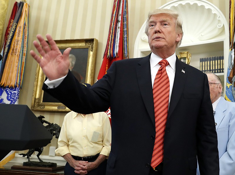 
              President Donald Trump waves as he departs after a meeting with survivors of the attack on USS Arizona at Pearl Harbor, in the Oval Office of the White House, Friday, July 21, 2017, in Washington. (AP Photo/Alex Brandon)
            