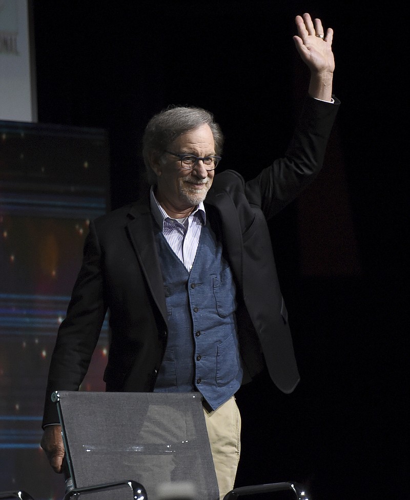 
              Steven Spielberg greets the audience as he walks on stage at the Warner Bros. "Ready Player One" panel on day three of Comic-Con International on Saturday, July 22, 2017, in San Diego. (Photo by Richard Shotwell/Invision/AP)
            