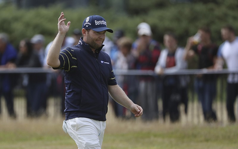 
              South Africa's Branden Grace waves as he makes his way along the 18th fairway during the third round of the British Open Golf Championship, at Royal Birkdale, Southport, England, Saturday July 22, 2017. (AP Photo/Peter Morrison)
            