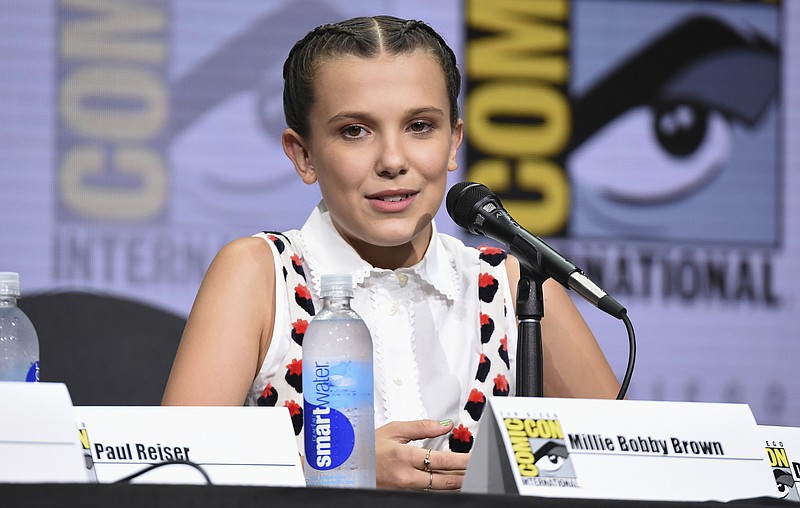 
              Millie Bobby Brown speaks at the "Stranger Things" panel on day three of Comic-Con International on Saturday, July 22, 2017, in San Diego. (Photo by Richard Shotwell/Invision/AP)
            