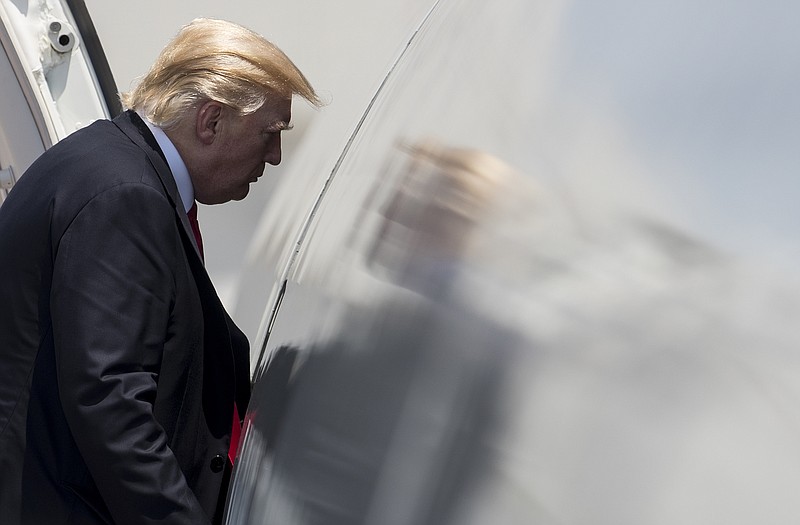 
              President Donald Trump boards Air Force One in Naval Air Station Norfolk, in Norfolk, Va Saturday, July 22, 2017, en route to Dulles International Airport, in Dulles, Va., after attending the commissioning ceremony of the aircraft carrier USS Gerald R. Ford (CVN 78). (AP Photo/Carolyn Kaster)
            