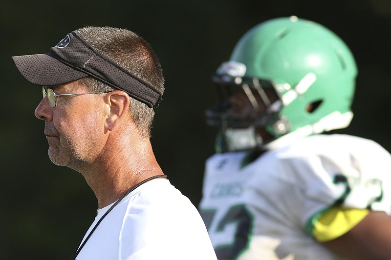 East Hamilton football coach Ted Gatewood oversees a preseason practice in July 2016. After acclimating in shoulder pads and shorts last week, Tennessee teams can begin full-pads practices today.