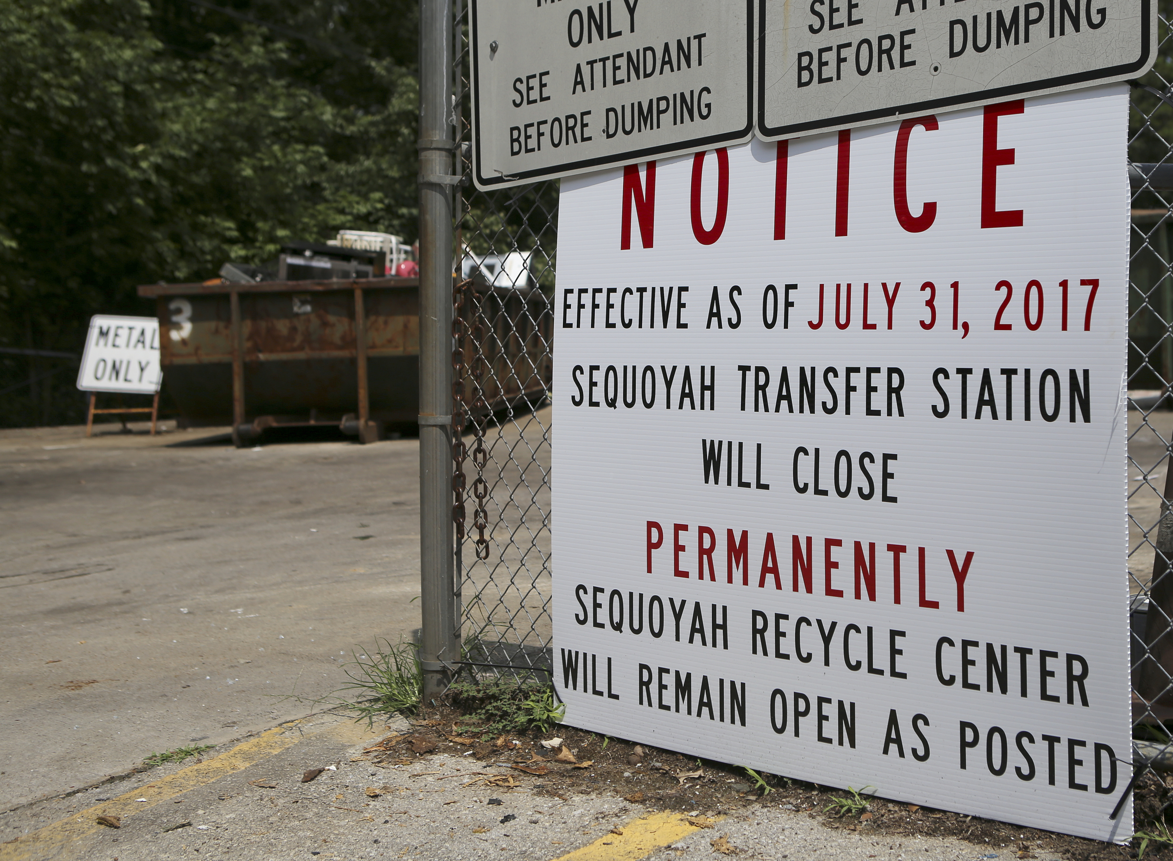 A sign announcing the permanent closure of the Sequoyah Transfer Station hangs on its fence on Thursday, July 20, in Soddy-Daisy, Tenn. While the transfer station is closing, the county-run recycling center next door will remain open.