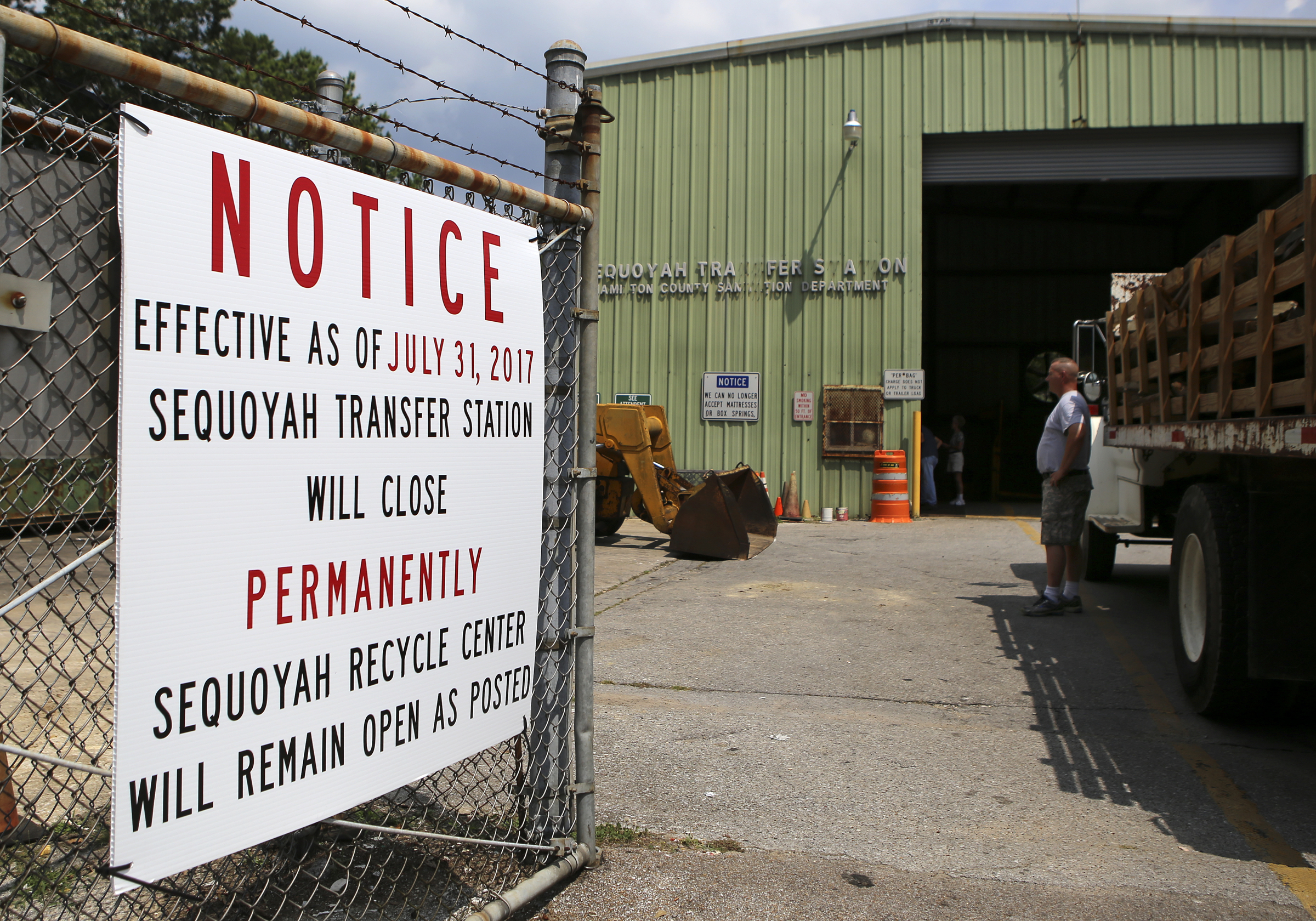 A sign announcing the permanent closure of the Sequoyah Transfer Station hangs on its fence on Thursday, July 20, in Soddy-Daisy, Tenn. While the transfer station is closing, the county-run recycling center next door will remain open.