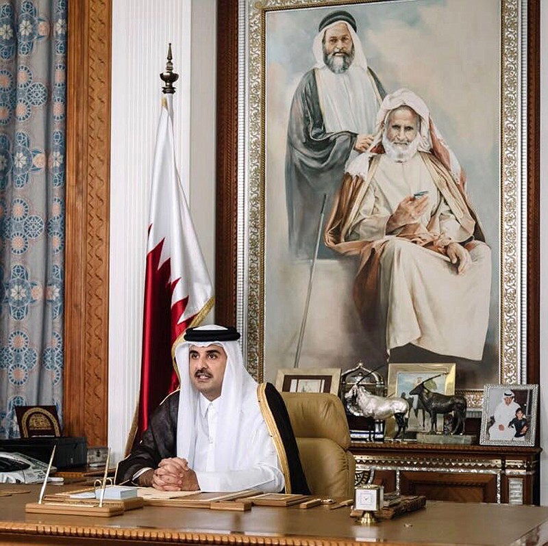 
              Emir of Qatar Sheikh Tamim bin Hamad Al Thani talks late Friday, July21, 2017 in his first televised speech since the dispute between Qatar and three Gulf countries and Egypt, in Doha, Qatar. Qatar's ruling emir says the embattled Gulf nation remains open to dialogue with four Arab countries that have isolated it, but that and resolution to the crisis must respect his country's sovereignty. (Qatar News Agency via AP)
            