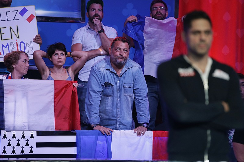 
              Supporters of Benjamin Pollak, right, of France, watch as he goes all-in at the World Series of Poker main event, Saturday, July 22, 2017, in Las Vegas. Pollak won the hand. (AP Photo/John Locher)
            