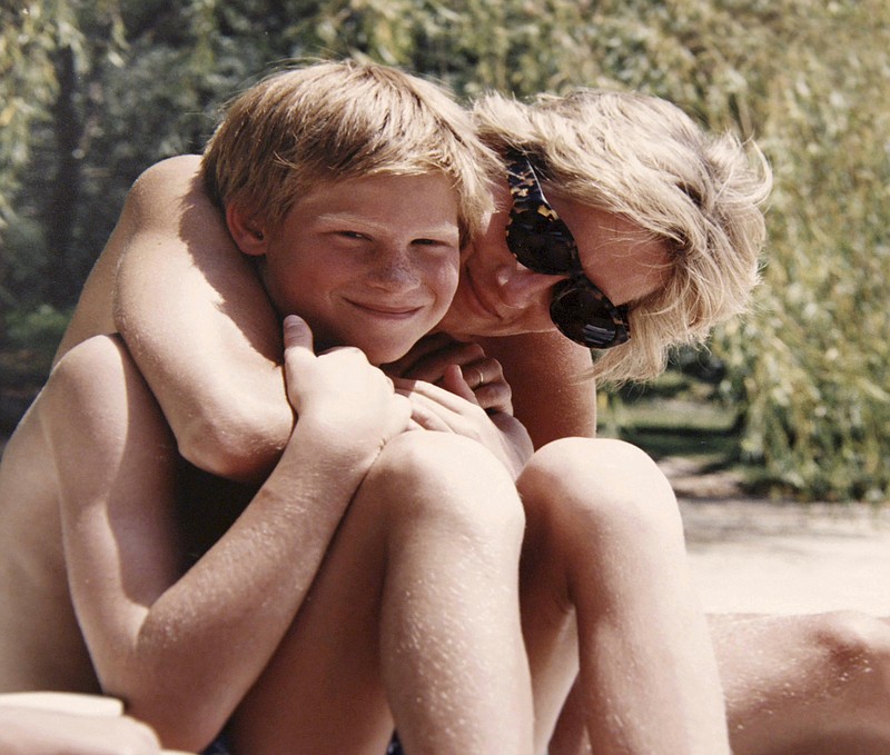 
              In this photo made available by Kensington Palace from the personal photo album of the late Diana, Princess of Wales, shows the princess and Prince Harry on holiday, and features in the new ITV documentary 'Diana, Our Mother: Her Life and Legacy.' Prince William and Prince Harry will pay tribute to their mother, Princess Diana, as the 20th anniversary of her death in a car crash approaches in a TV documentary “Diana, Our Mother: Her Life and Legacy” which will air Monday July 24, 2017 on British TV. (The Duke of Cambridge and Prince Harry/Kensington Palace via AP)  NO USE ON THE FRONT COVERS OF ANY UK OR INTERNATIONAL MAGAZINES. NO COMMERCIAL USE (including any use in merchandising, advertising or any other non-editorial use including, for example, calendars, books and supplements).
            