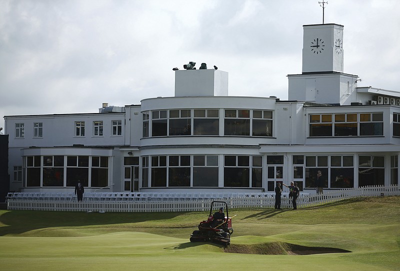 
              A groundsman prepares the 18th green ahead of the final round of the British Open Golf Championship, at Royal Birkdale, Southport, England, Sunday July 23, 2017. (AP Photo/Dave Thompson)
            