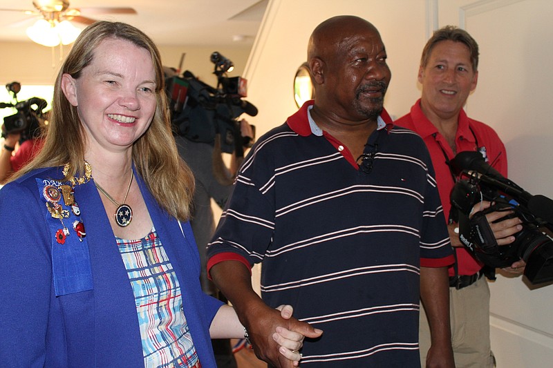 Stacy Kehoe gives James Cosey a tour of his new home on Veterans Way. (Contributed photo)