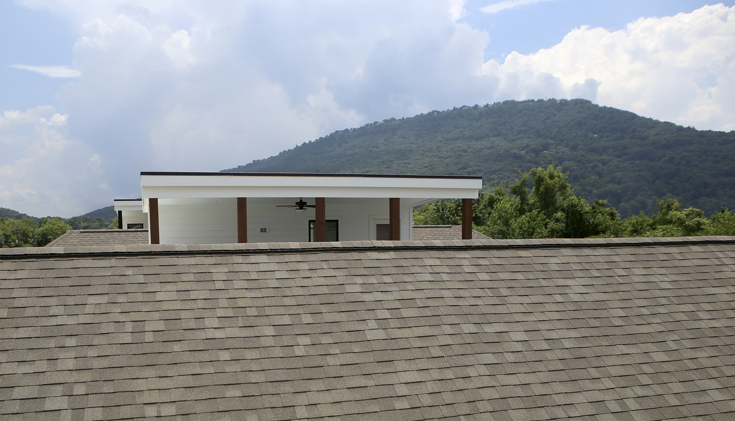 A private rooftop terrace is seen at One Hundred at South Broad on Wednesday, July 12, in Chattanooga, Tenn. The rooflines of the neighboring homes help make the open-air terrace private.