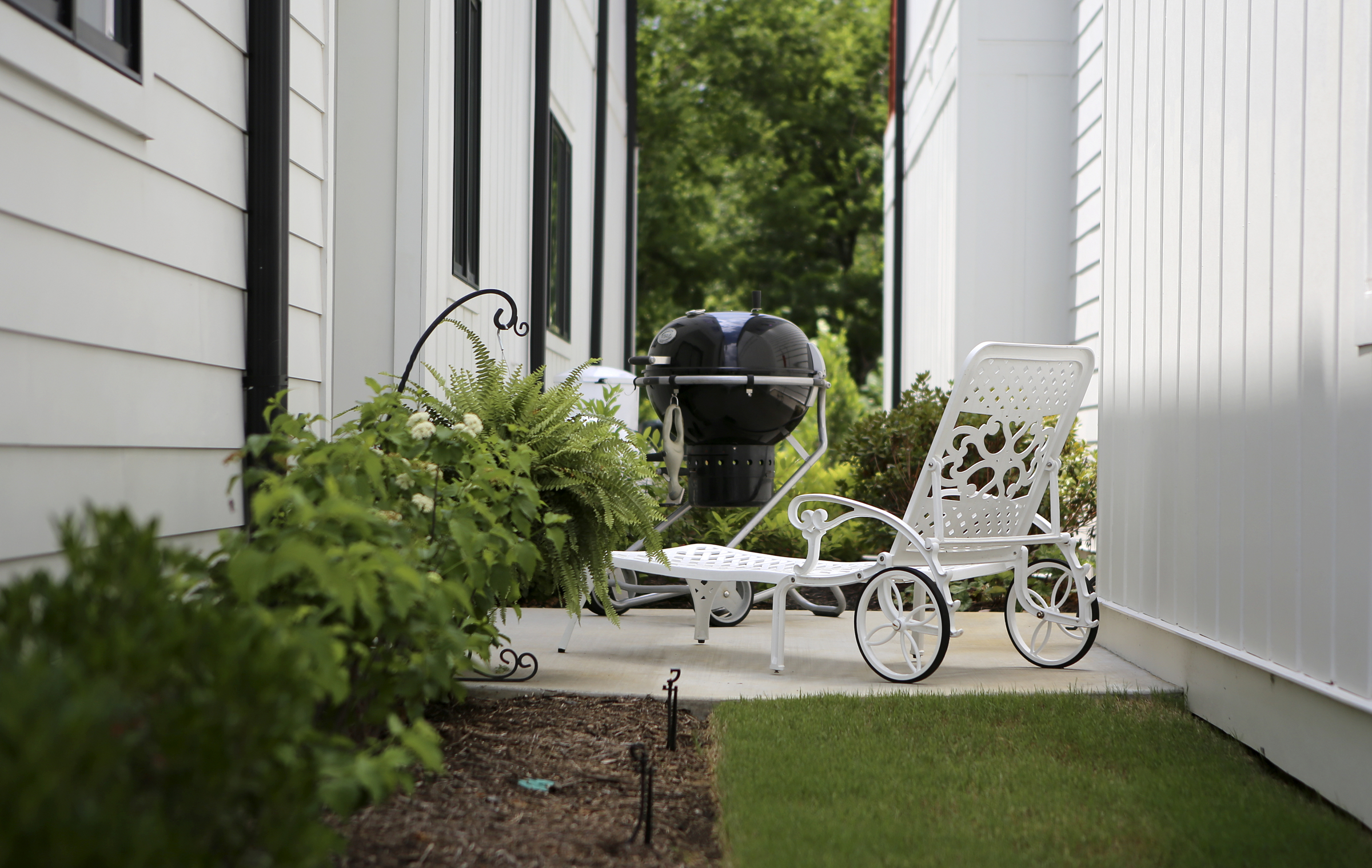 The private area between two homes at One Hundred at South Broad is seen on Wednesday, July 12, in Chattanooga, Tenn. The home on the right only has windows in the stairwell, creating a private space for the home on the left, which has windows overlooking the area.