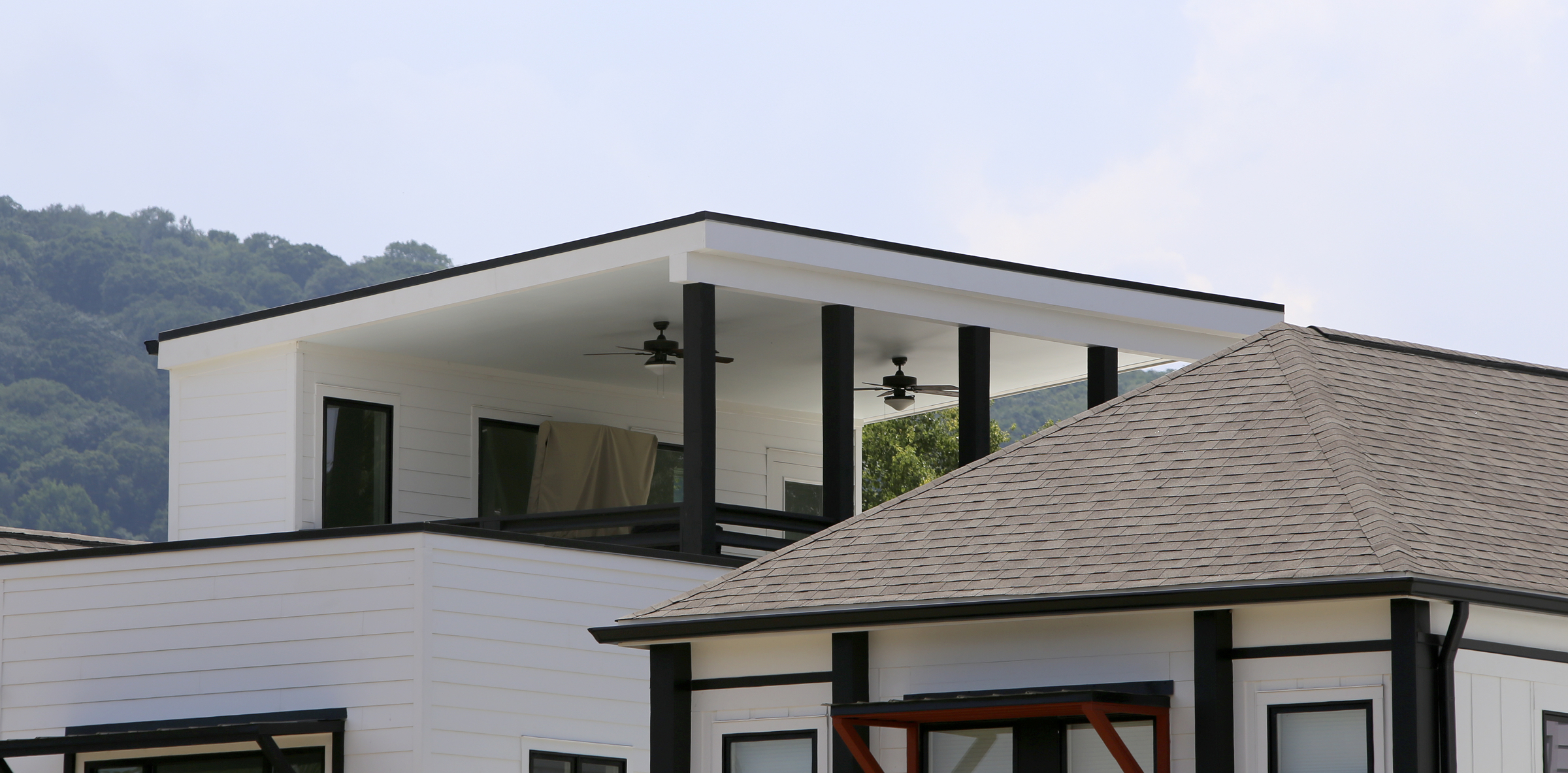 A private rooftop terrace is seen at One Hundred at South Broad on Wednesday, July 12, in Chattanooga, Tenn. The rooflines of the neighboring homes help make the open-air terrace private.
