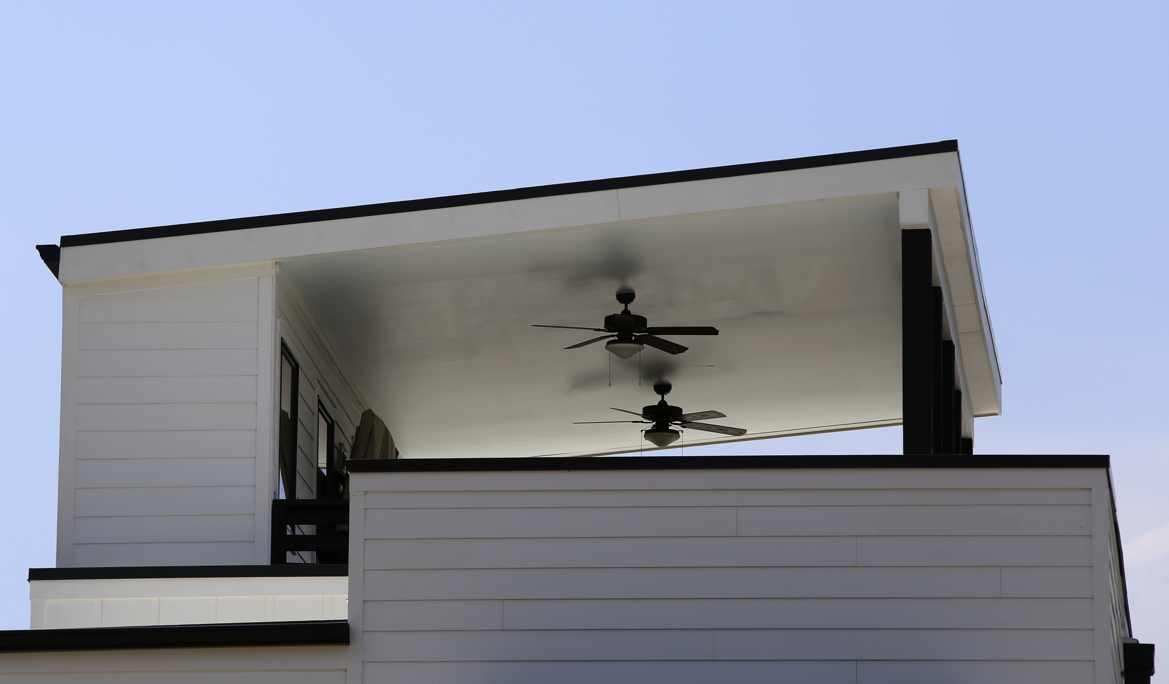 A private rooftop terrace is seen at One Hundred at South Broad on Wednesday, July 12, in Chattanooga, Tenn. The rooflines of the neighboring homes help make the open-air terrace private.