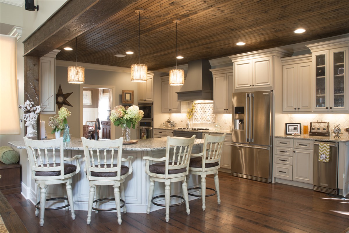 Stained beadboard ceilings, like the one shown in a kitchen of Pratt Home Builders home, are becoming popular.