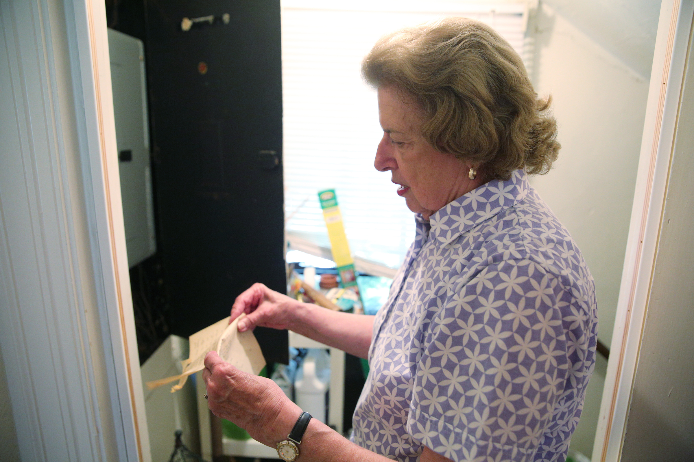 Barbara Blake opens the fuse box Wednesday, July 12, 2017, at her home on Sunset Road in Chattanooga, Tenn. Parts of the box are original to the 1925 house.