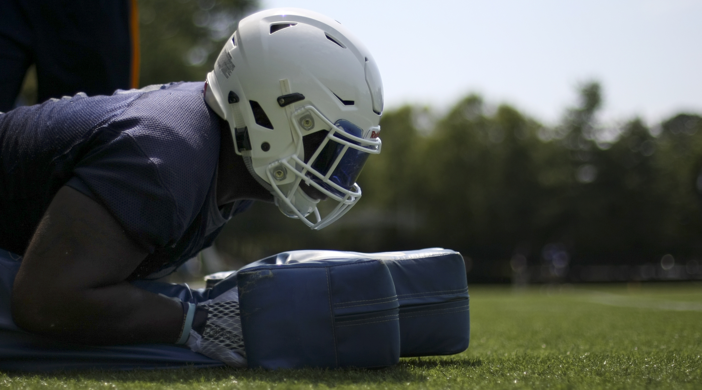 UTC defensive lineman Derek Mahaffey tackles a bag to the turf during the first day of fall practice at Scrappy Moore Field on Monday, July 24, in Chattanooga, Tenn.
