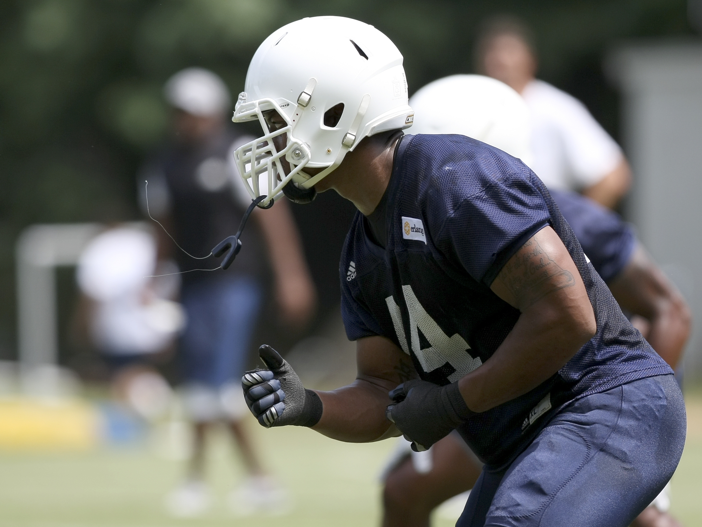 UTC defensive lineman Khayyan Edwards runs a drill during the first day of fall practice at Scrappy Moore Field on Monday, July 24, in Chattanooga, Tenn.
