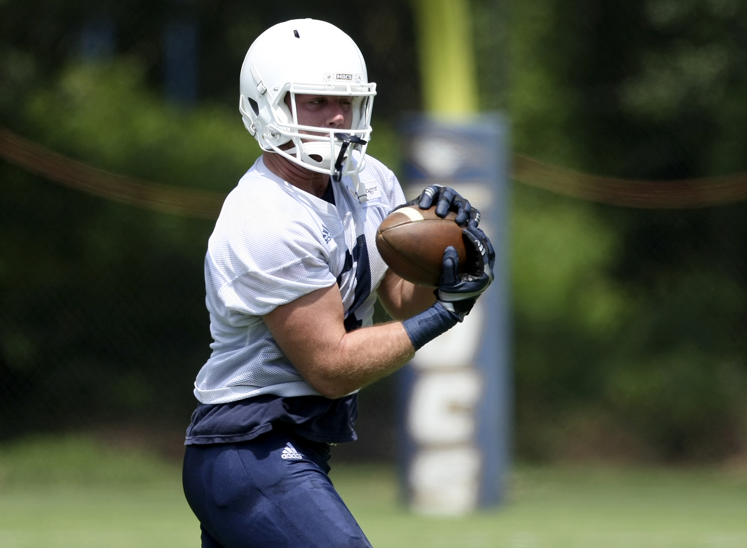 UTC tight end Bailey Lenoir catches a pass during the first day of fall practice at Scrappy Moore Field on Monday, July 24, in Chattanooga, Tenn.