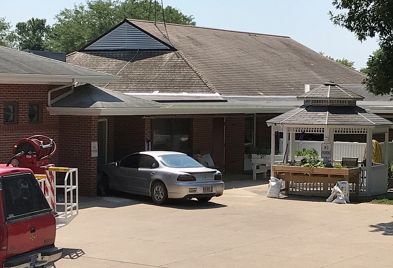 
              A car is seen outside the Alcester Care and Rehab Center after it slammed into a group of people and crashed into the center Monday, July 24, 2017, in Alcester, S.D. Authorities said at least two people were killed and multiple others injured. A Highway Patrol spokesman said the investigation is ongoing, but the crash appears to have been accident. The driver of the vehicle was among those brought to a hospital. (Trevor Mitchell/Argus Leader via AP)
            
