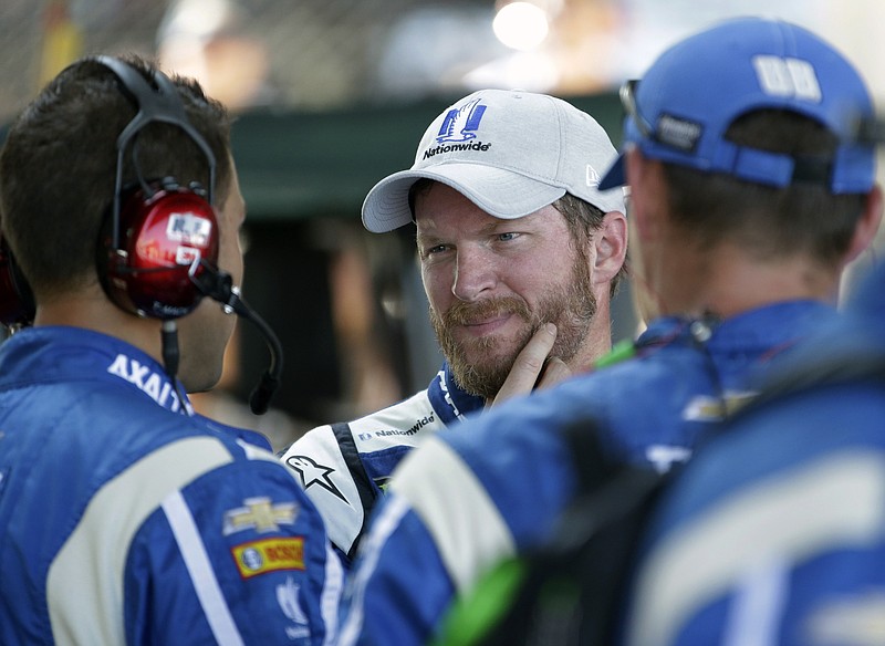 
              Dale Earnhardt Jr. (88) talks with his crew after dropping out of the NASCAR Brickyard 400 auto race at Indianapolis Motor Speedway in Indianapolis, Sunday, July 23, 2017. (AP Photo/AJ Mast)
            